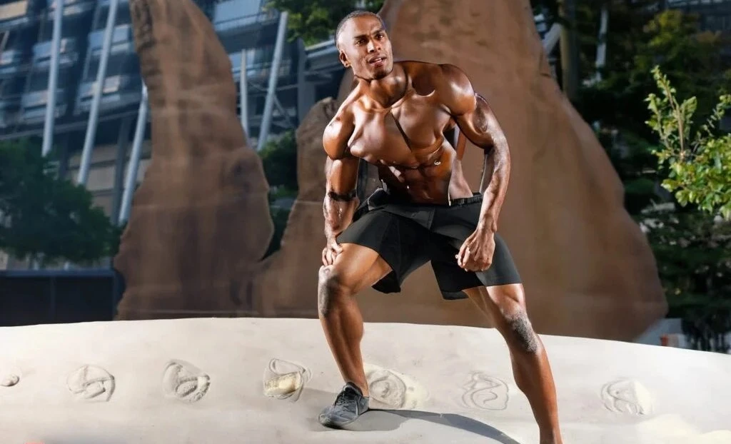 An action shot of Dwayne "The Rock" Johnson on set, showcasing his towering 6 feet 5 inches stature.